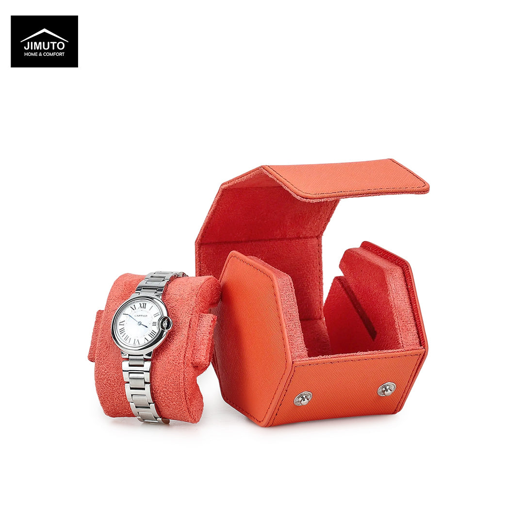 An orange leather watch box set by Jimuto, featuring a silver metal bracelet watch on a matching orange cushion and an open hexagonal watch box with a white dial.