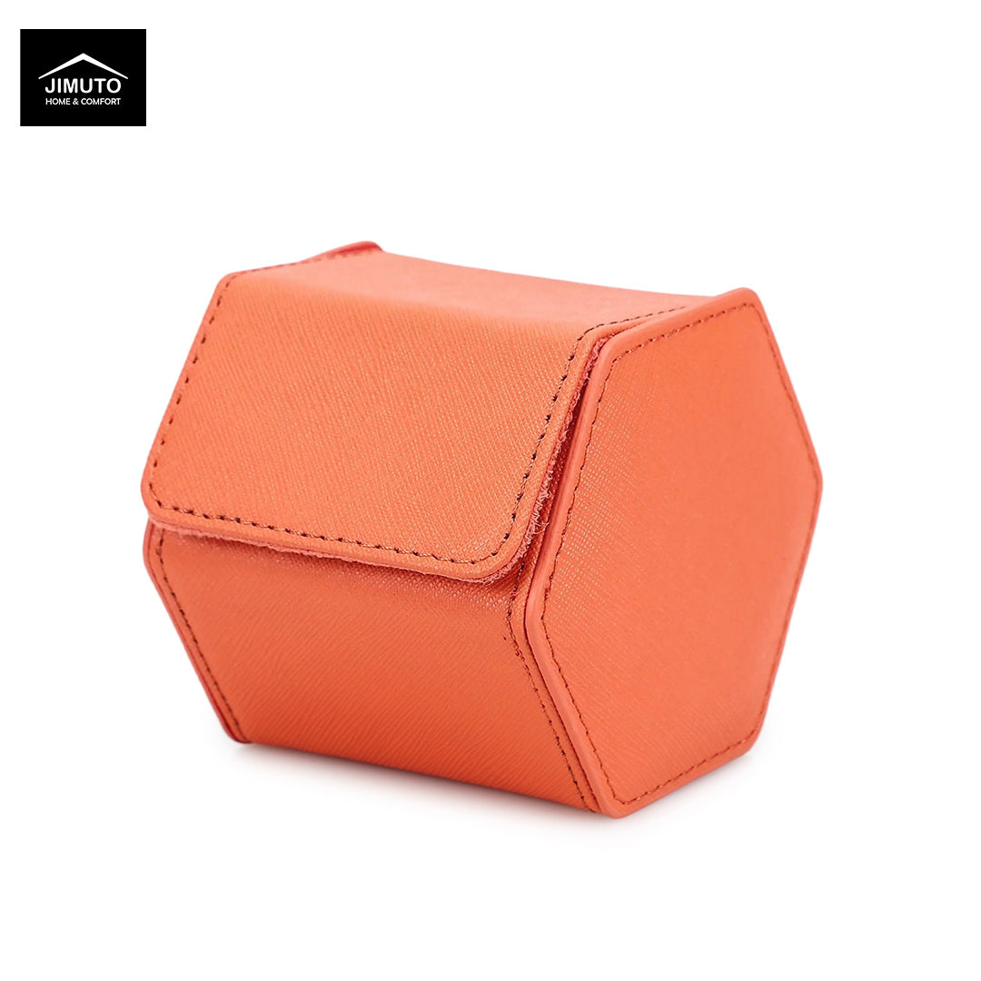 An orange hexagonal faux leather watch box with a textured finish and a top flap, shown on a white background with a Jimuto brand logo in the top-left corner.
