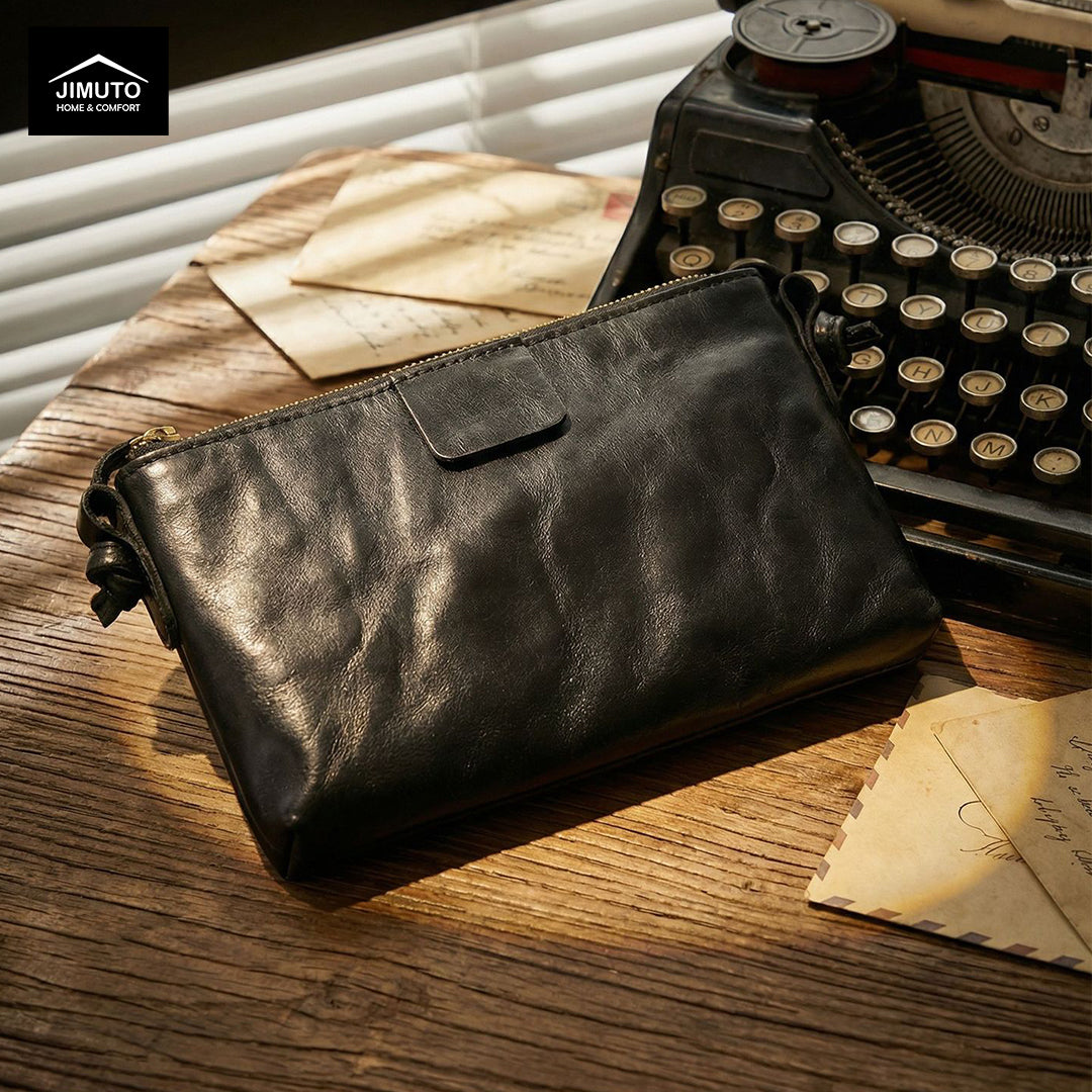 Black leather crossbody bag on a white background with 'JIMUTO' 