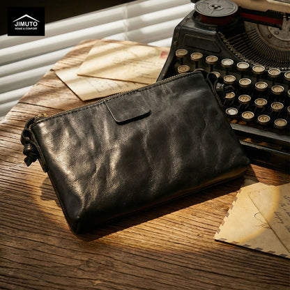Black leather crossbody bag on a white background with 'JIMUTO' 
