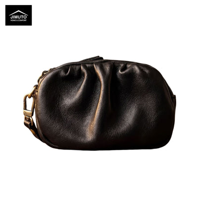Black leather pouch with gold zipper on a white background, featuring the JIMUTO brand.