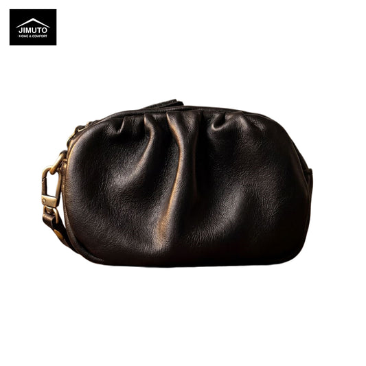 Black leather pouch with gold zipper on a white background, featuring the JIMUTO brand.