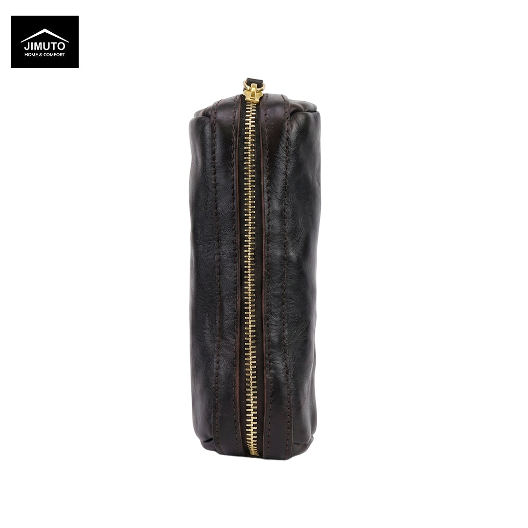 A dark brown leather zippered pen pouch with a gold-tone zipper, shown vertically against a plain white background. The Jimuto logo is visible in the top-left corner.