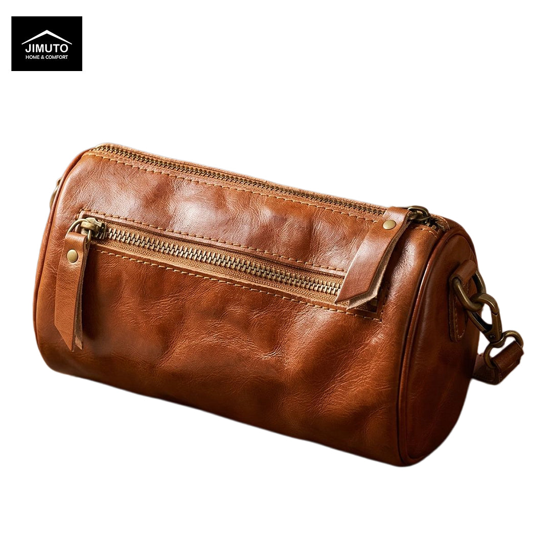 Brown leather duffel bag with gold zipper on a white background, featuring the JIMUTO brand.
