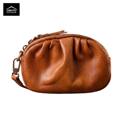 Brown leather clutch bag with a chain strap on a white background, featuring the JIMUTO brand.