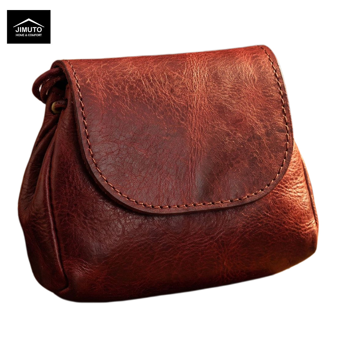 A brown textured leather clutch with a curved flap and visible stitching, shown on a plain white background with a Jimuto logo in the top-left corner.