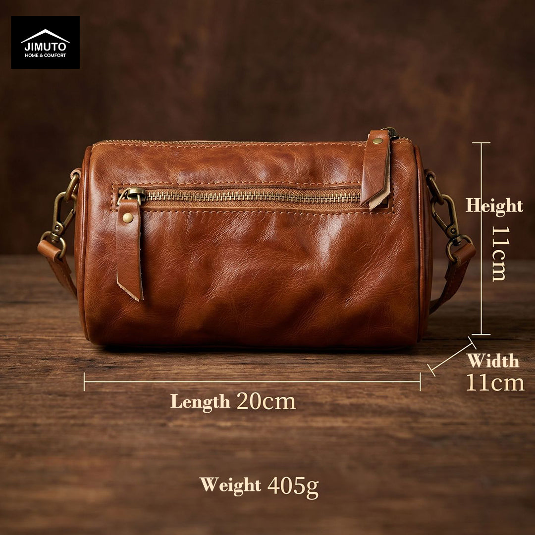 Brown leather handbag with measurements on a wooden surface, featuring the JIMUTO brand.