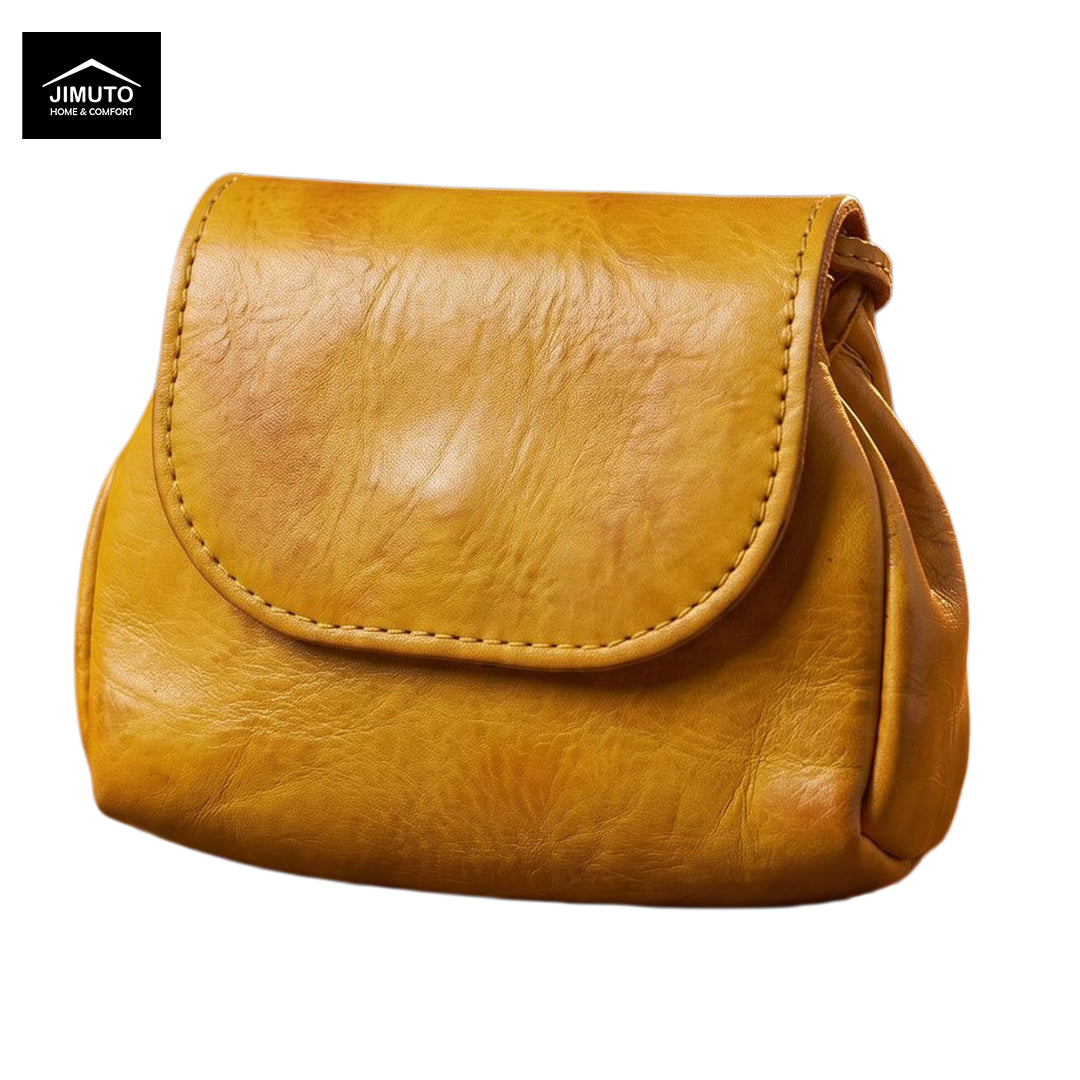 A mustard yellow leather clutch with a textured finish and a stitched flap closure, shown against a plain white background with a JIMUTO brand logo in the top-left corner.